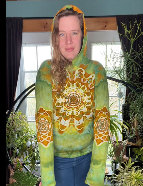 green and orange tie-dye hoodie with a mandala